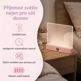 Růžové ploché světlo na čtení postavené na nočním stolku jako lampička